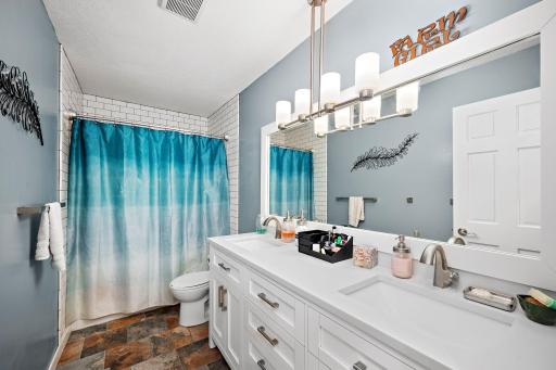 Updated main level bathroom with double sink vanity, new fixtures