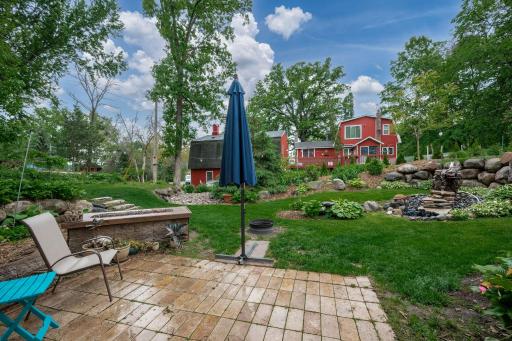 Inviting patio with gas firepit (plumbed in gas) to the left or traditional firepit in center of photo
