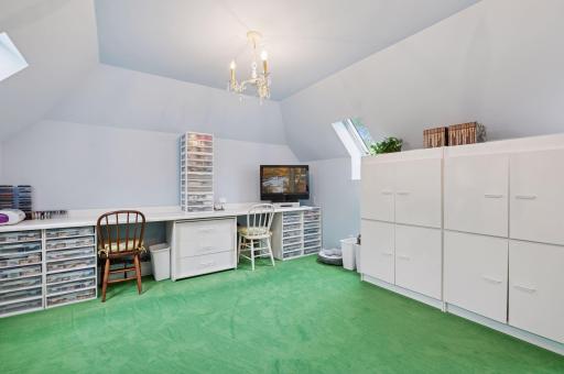 There is a WONDERFUL bonus space above the garage through the 2nd and 3rd bedrooms. Used as a kids' playroom for many years, now a craft room, but the possibilities are endless!
