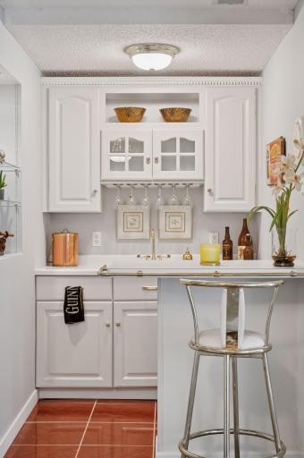 Fully stocked wet-bar area, perfect for entertaining.