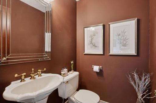 Main floor powder room located conveniently in the mudroom area.