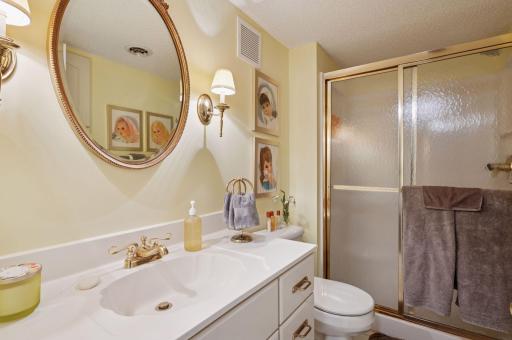 The 4th bathroom is directly across the hall from the guest room. With the downstairs 2nd kitchen and 2nd laundry, there's practically an entire separate living quarters downstairs.