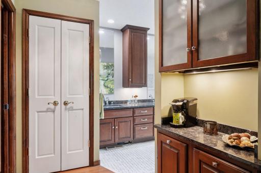 The primary suite includes bedroom, walk-in closet, primary bath, morning breakfast bar including fridge and microwave, dual vanity, marble tile, and washer/dryer!