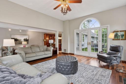 The main floor living room connects to kitchen as well as the outdoor rooftop deck! One of many patios at 1511 Colleen.