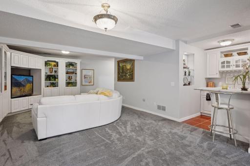 Family room with wet-bar for convenient guest access.