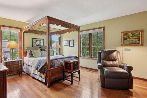 Step into a primary bedroom that blends luxury and comfort in stunning harmony.