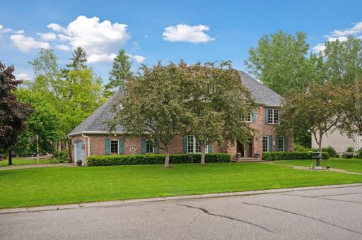 Attached 2 car garage...from all angles this is a beautiful home with lovely brick and stucco exterior creating a Country French maintenance free exterior.
