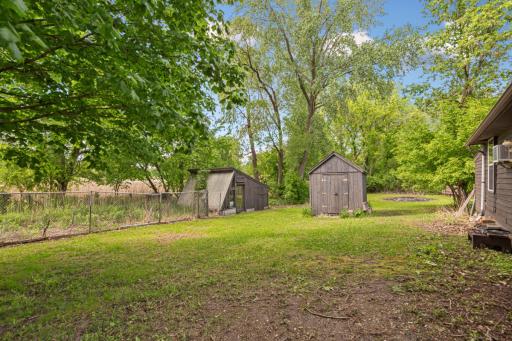 2 outbuildings, 1 is a greenhouse and the other one is a storage shed.