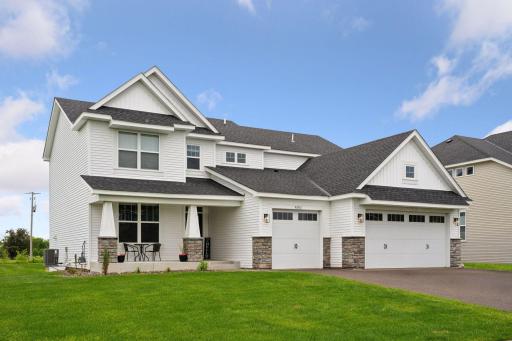 The meticulously landscaped yard, complete with irrigation and a welcoming front porch, is just the beginning of amenities you will appreciate.