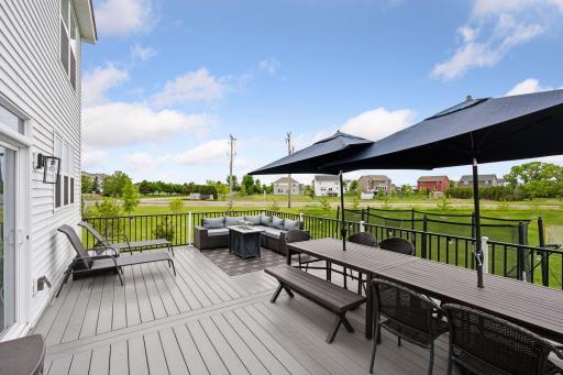 Gorgeous composite deck with lounge seating, dining area, and nice grill spaceâideal for entertaining.