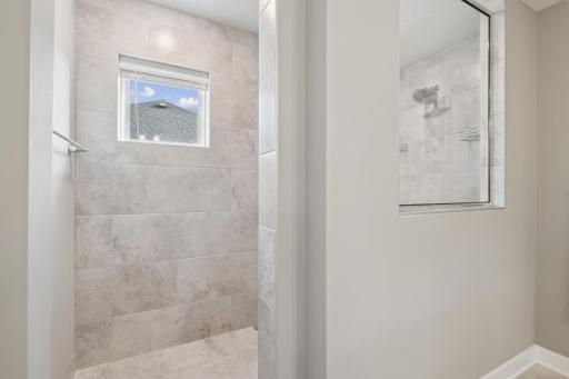Huge luxurious tiled shower is a perfect way to start or end your day.