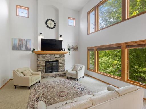 Awesome two story great room with tons of natural light and gas fireplace.