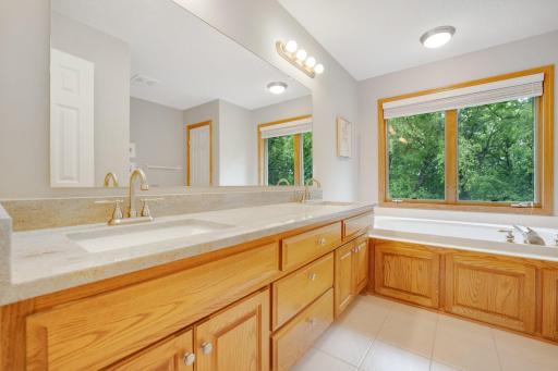 Primary Full Bath with dual sinks and granite countertops