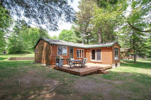 Welcome to 1378 Sunflower Trail NE! An adorable log sided cabin plus a 32x60 garage building situated on the quiet shore of high demand Washburn Lake!