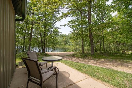 From outside the rec/bunk area at back of garage, a view of Margaret Lake. That is Peninsula Road. Easy access from property to a township maintained road!