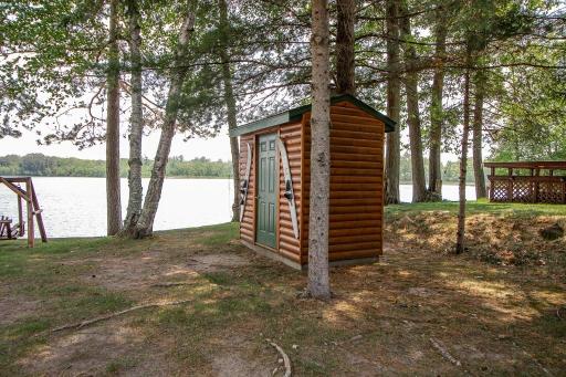 Nice lakeside shed offers storage space for lake stuff.