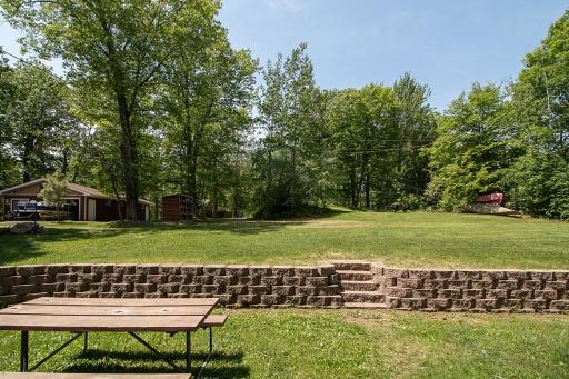 Looking from the cabin towards the back of the property. Large open sunny yard space!