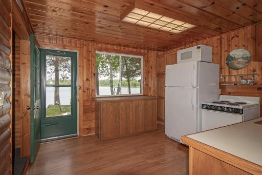 Kitchen features large window towards lake and door to deck!
