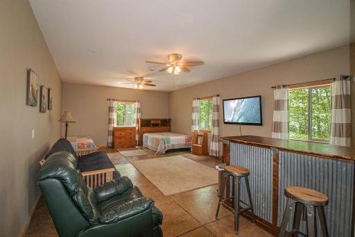 32x14 rec area/bunk room at the back of the garage! Beds included. Great area for extended family or guests.