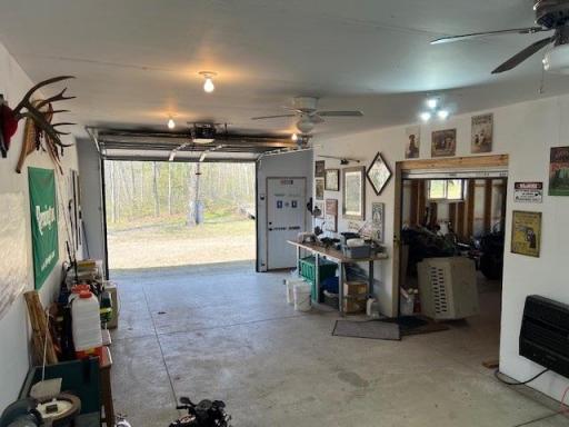 CONVENIENT side overhead door to shop! Easy access to shop for repairs. Or during cold weather, allows your stuff to warm up/melt snow!