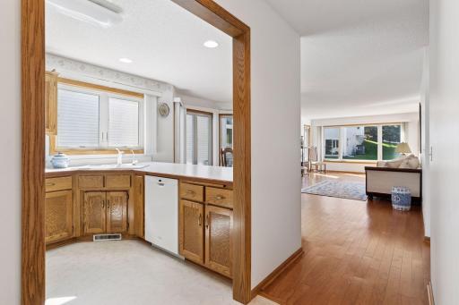 Open floor plan with sight lines to backyard/pond.