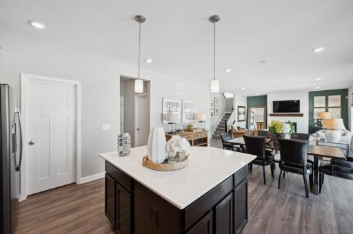 Photo of a model home, colors and finishes will vary. Open concept, the home's kitchen space is highly desirable and features a large kitchen island serving as the perfect centerpiece for cooking and entertaining!