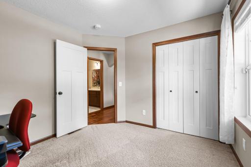 Versatile Second Bedroom – Ideal as a guest room, office, or den with front-facing window and natural light.