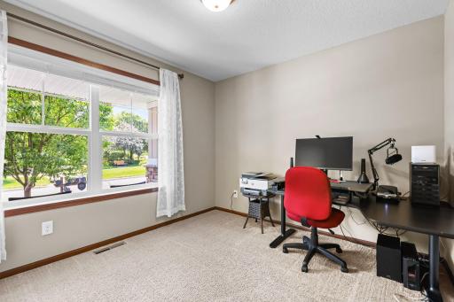 The 2nd bedroom has large windows that overlooks the front porch and neighborhood green space.