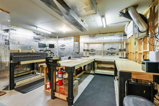 Endless possibilities await in this spacious utility room—perfect for projects, storage, or your dream workshop! Most of the workbenches stay.