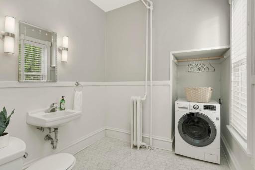 Main level 1/2 bath with washer/dryer combo unit.