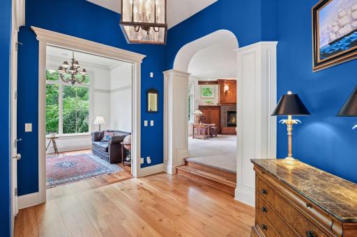 Inviting foyer leads to sun room, formal dining room, and great room