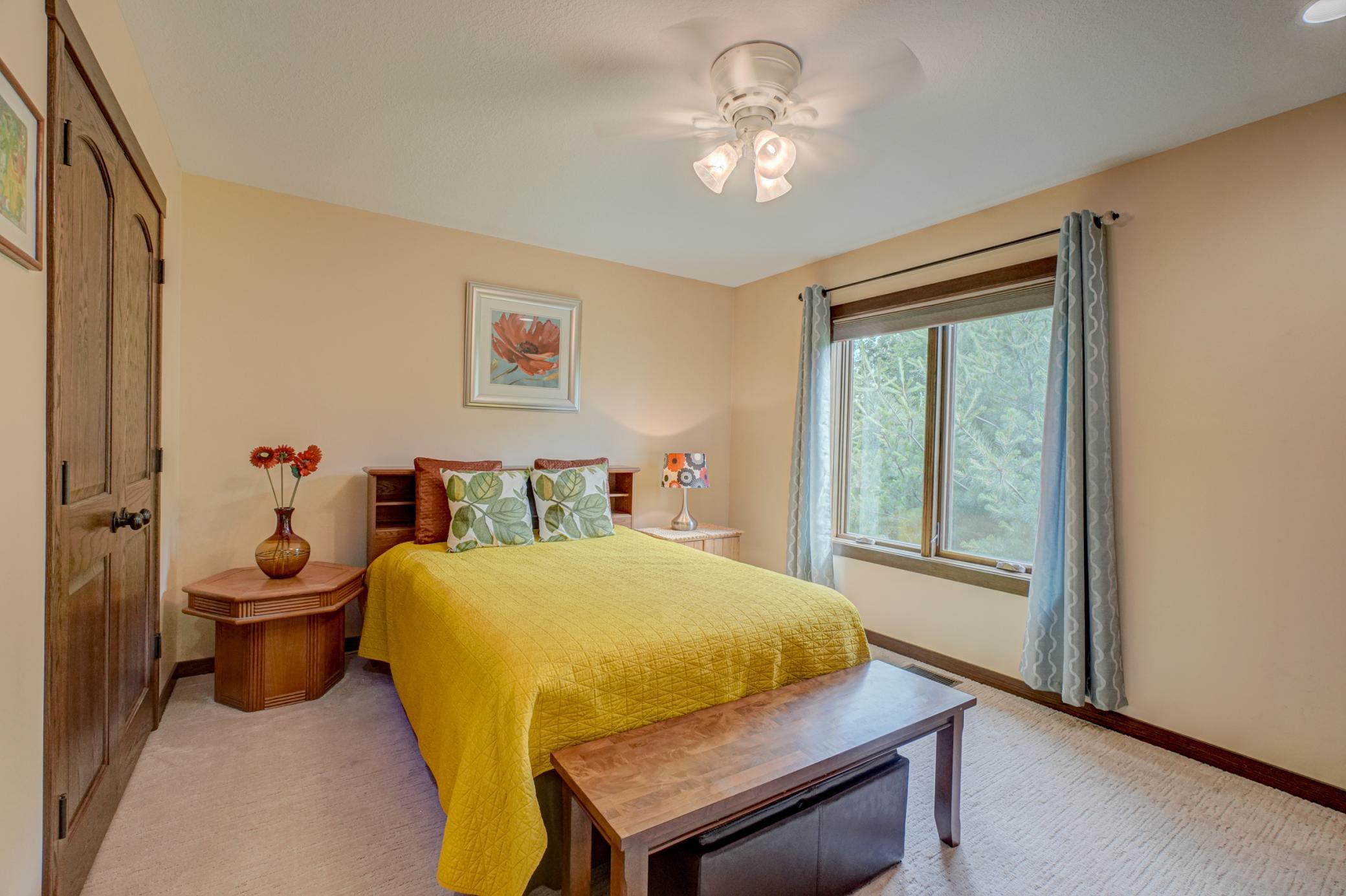 A second main-level bedroom includes an ensuite bath.