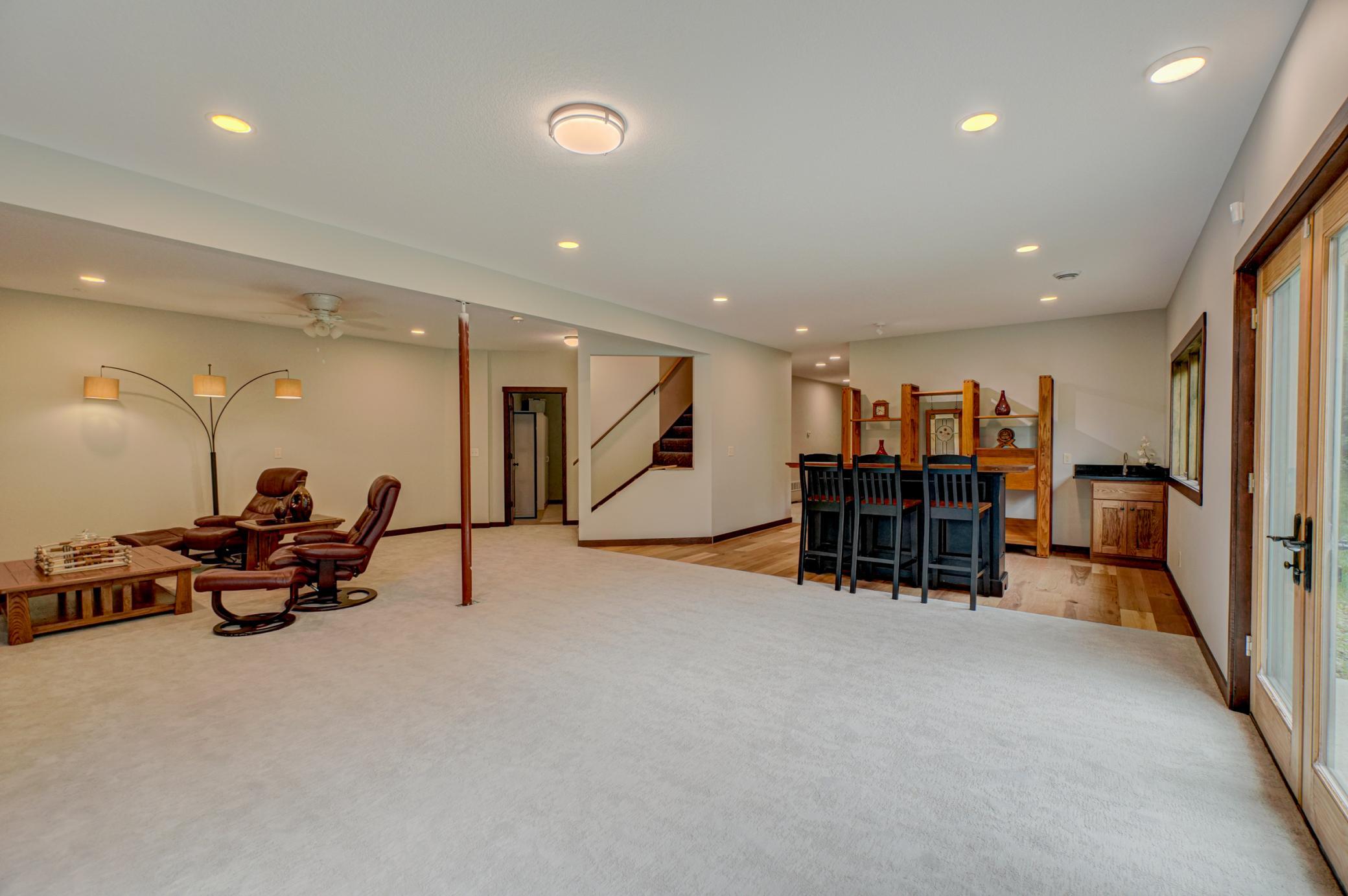 Retreat to the brand-new finished walkout basement offering a large living area, wet bar, two additional bedrooms, a luxurious full bath, and tons of storage—perfect for everyday living and entertaining.