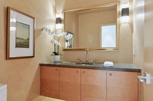 Elegantly appointed powder bath on the main floor