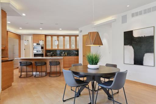 The informal dining area flows seamlessly off the kitchen
