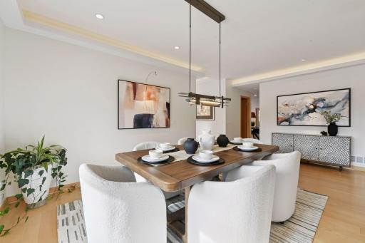 The formal dining room is flooded with natural light