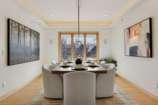 The formal dining room offers ample space to gather, perfect for hosting memorable dinners