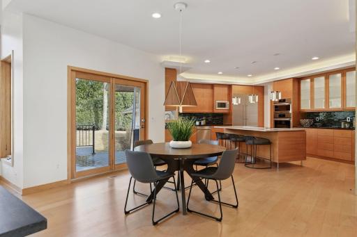 This inviting space is perfect for gatherings, offering easy access to the deck and the outdoors