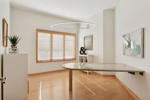 The fifth bedroom offers versatility, perfect for a comfortable bedroom or creative craft room