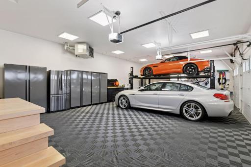 The garage features a double utility sink and wall-mounted setup with a softened hot/cold water, perfect for pet or car washings