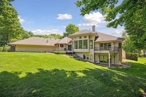 Explore the expansive backyard, offering ample space for entertainment and outdoor enjoyment