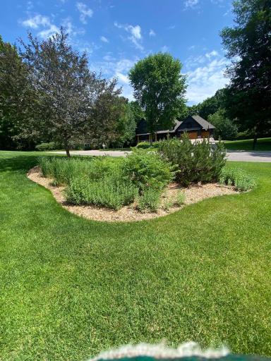 Lush greenery and beautifully designed garden area surround the property