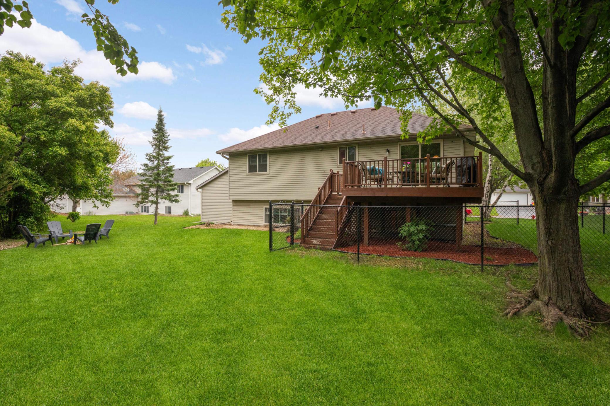 Backyard with views to the deck and fenced-in yard
