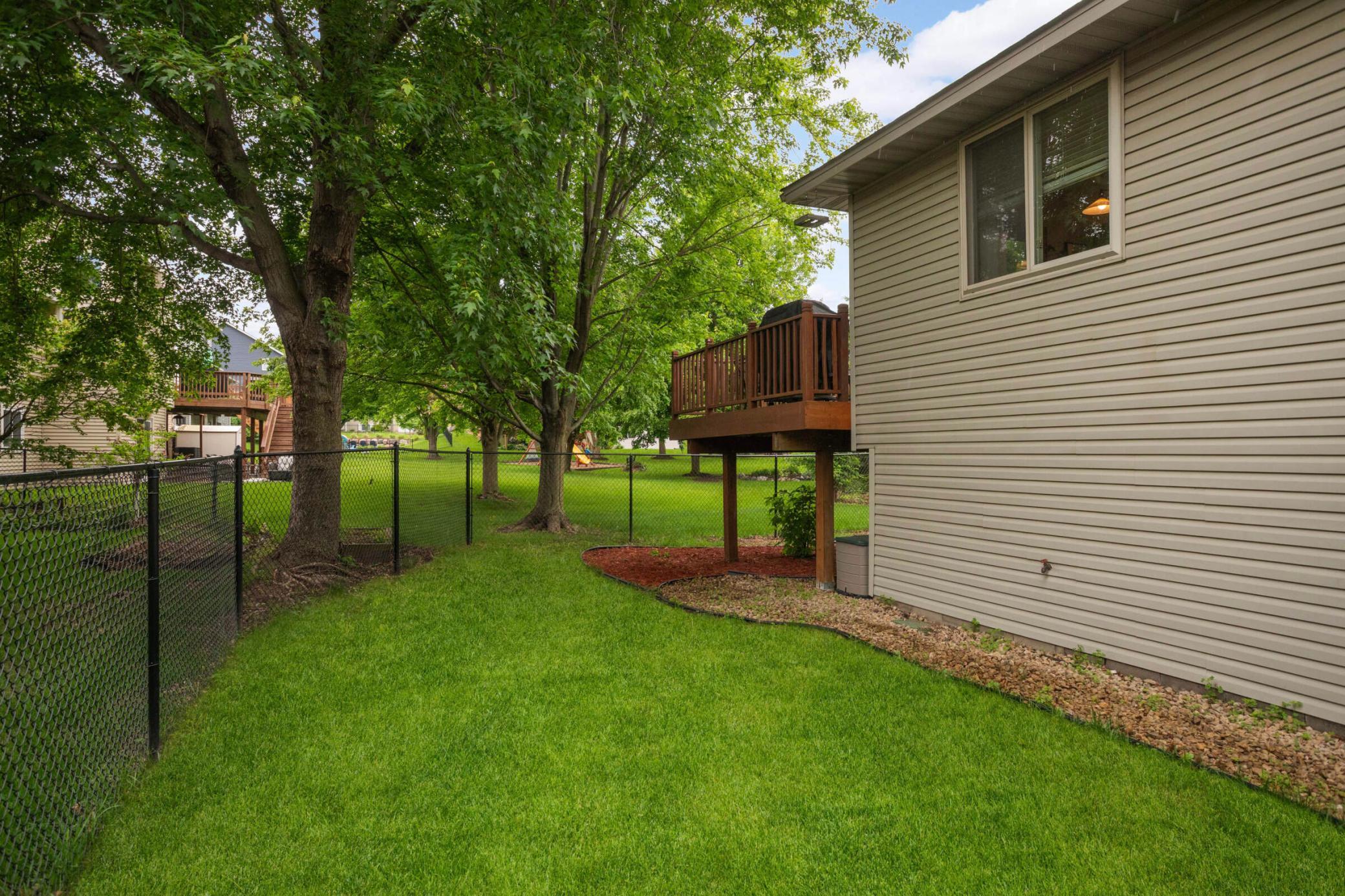 The fenced-in yard is perfect for dogs to run free