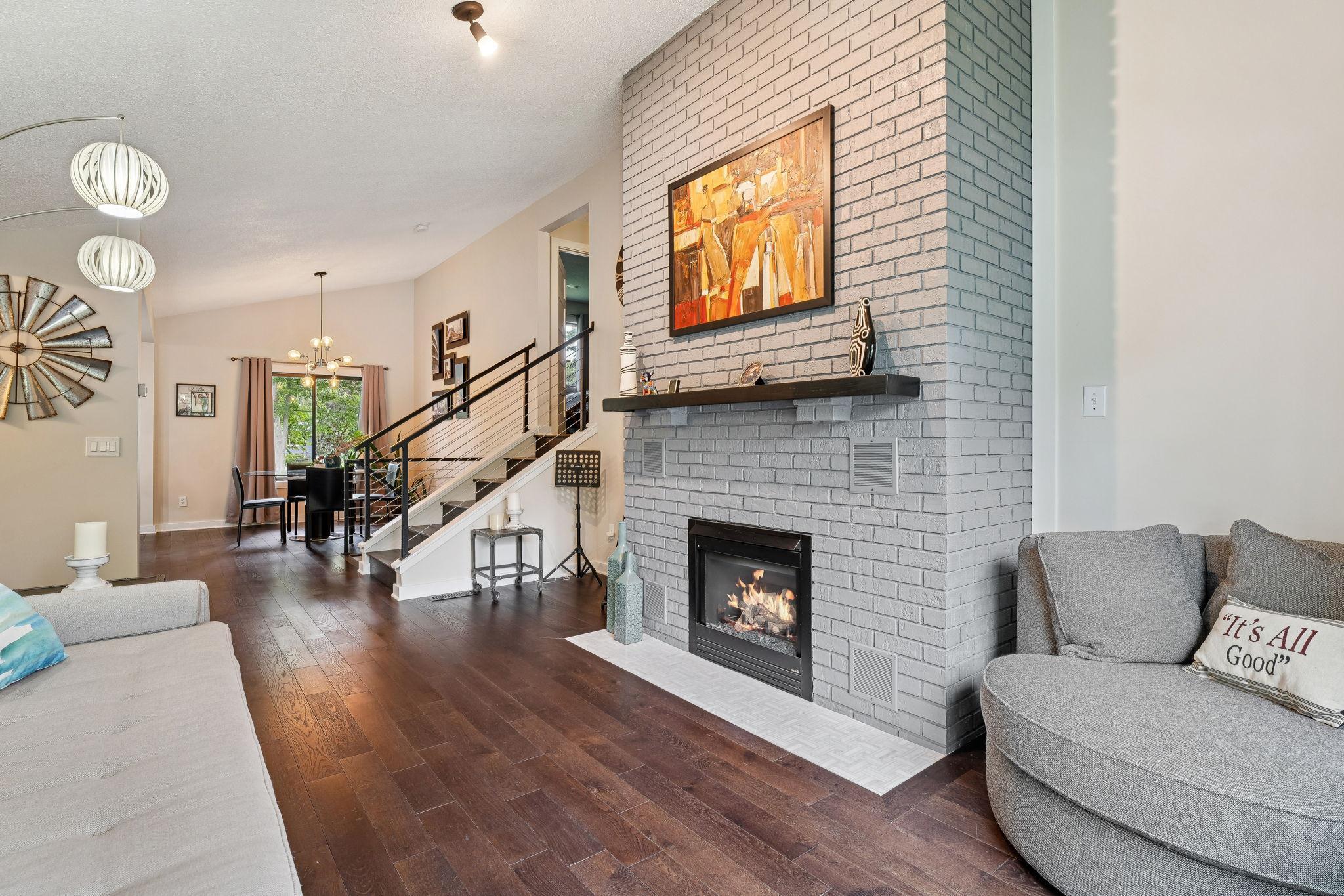Open-concept main level with seamless flow from the living area to the dining space.