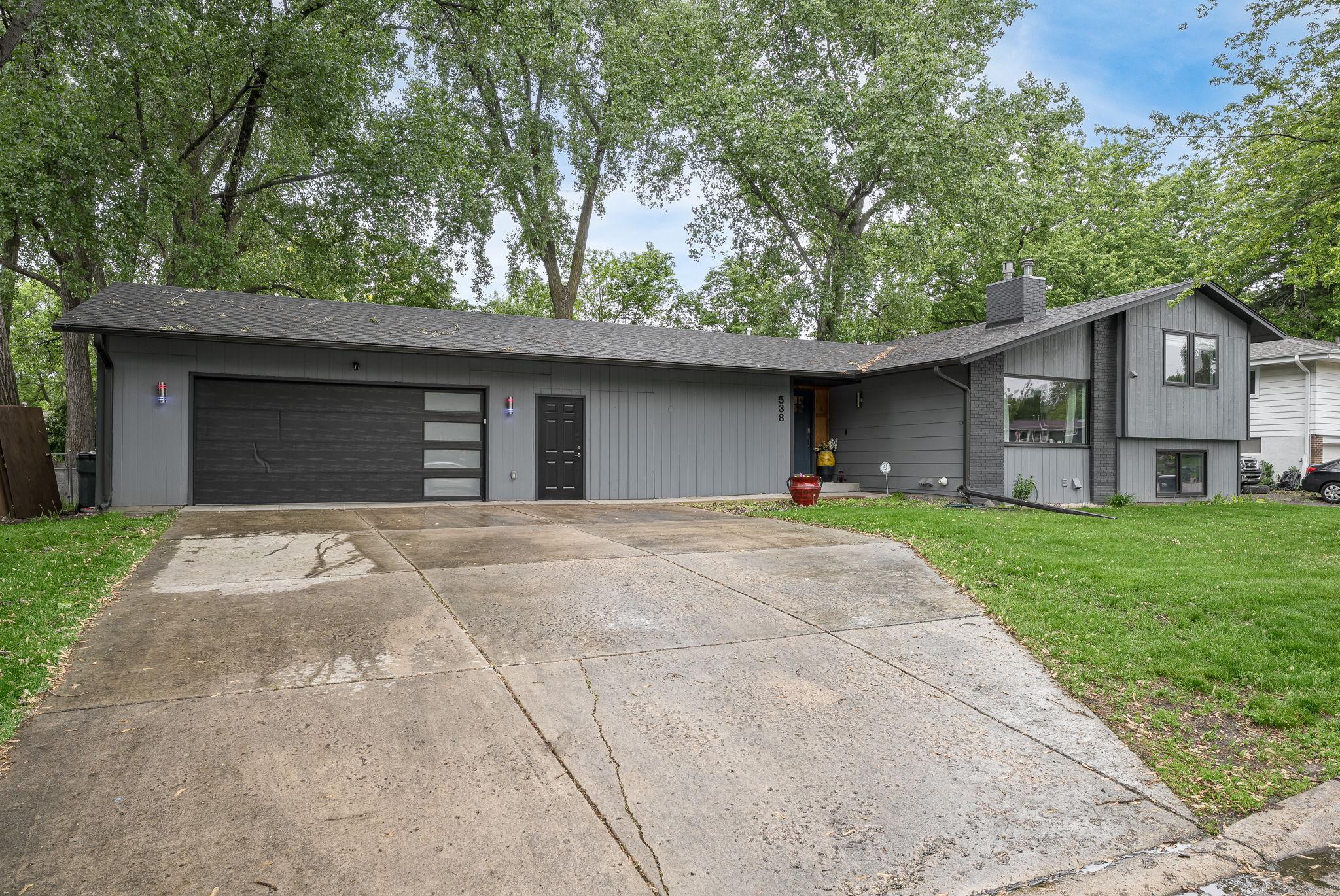 Extra wide concrete driveway for additional parking.