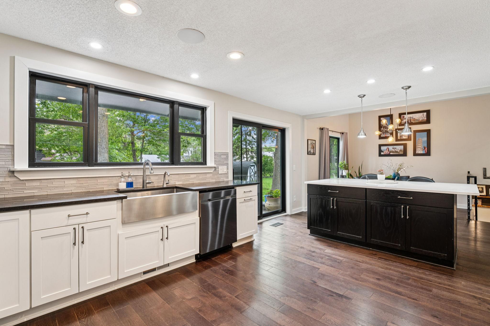 The kitchen walks out to a stunning patio area, perfect for grilling and entertaining.