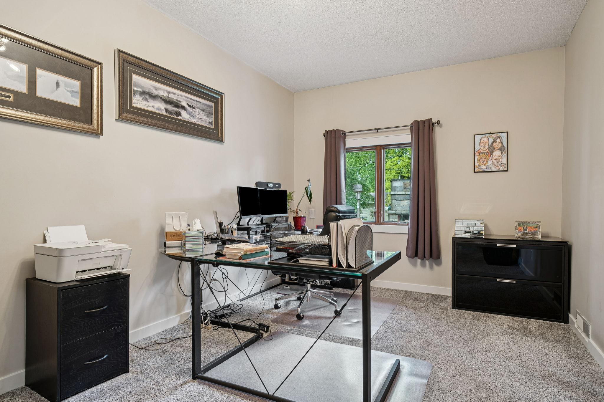 Bedroom #5 is conveniently located on the main level and is currently used as a home office, offering flexibility to suit your needs.