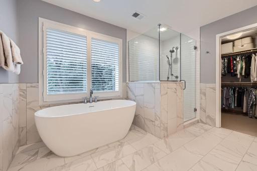 Unwind in style with a soaking tub, walk-in shower, and dual vanitiesâyour personal haven of relaxation and sophistication.