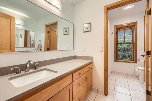 2nd Floor Bathroom is very large with tile flooring. Separate tub/shower & toilet make this a great sharable space if needed. Ample storage too!